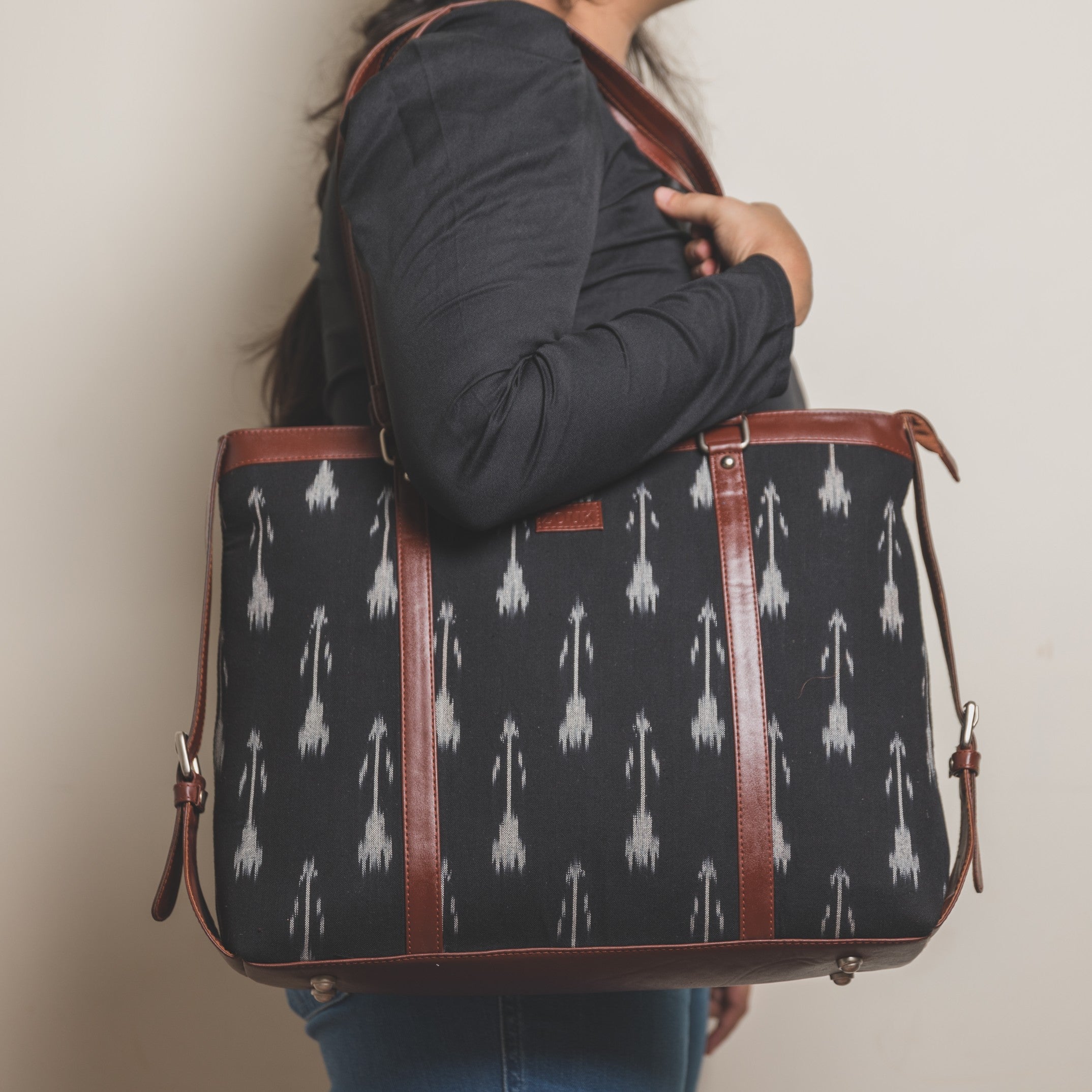 Zouk Ikat Arrow Women's Office Bag - Model holding the bag on shoulder side view
